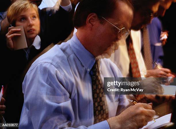 floor traders at the stock exchange - trading floor stock pictures, royalty-free photos & images