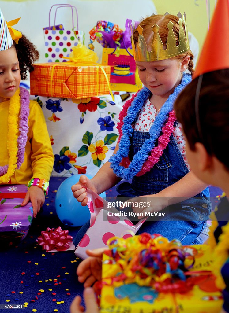 Girl Opening Her Birthday Gifts