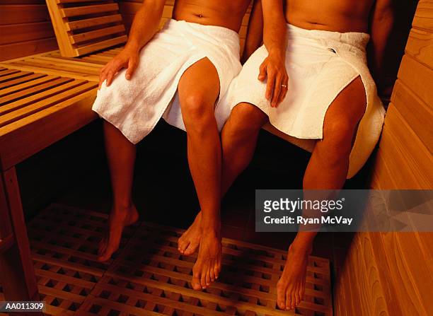 couple in a sauna - sauna stock pictures, royalty-free photos & images