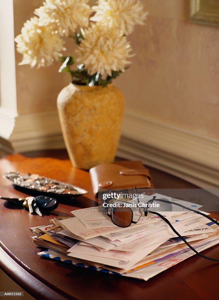 Mail, Sunglasses, Keys and Wallet on a Table