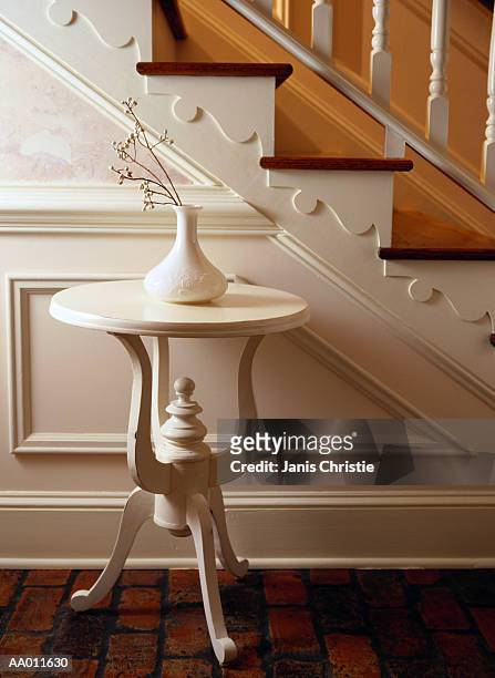 white vase on a table beside stairs - hollister bildbanksfoton och bilder