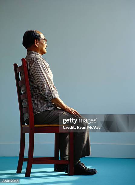 portrait of an elderly man sitting - 良い姿勢 ストックフォトと画像