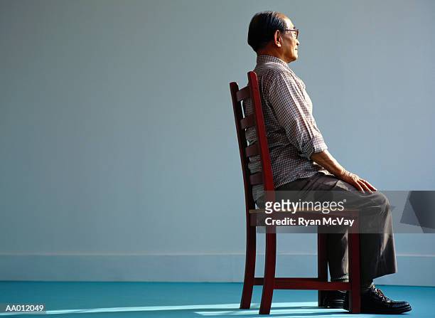 elderly man sitting - 良い姿勢 ストックフォトと画像