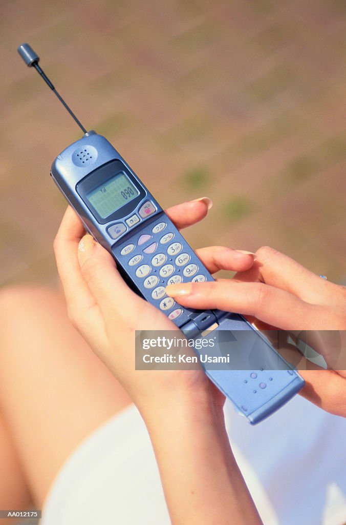 Above View of a Woman Dialing a Cellular Phone