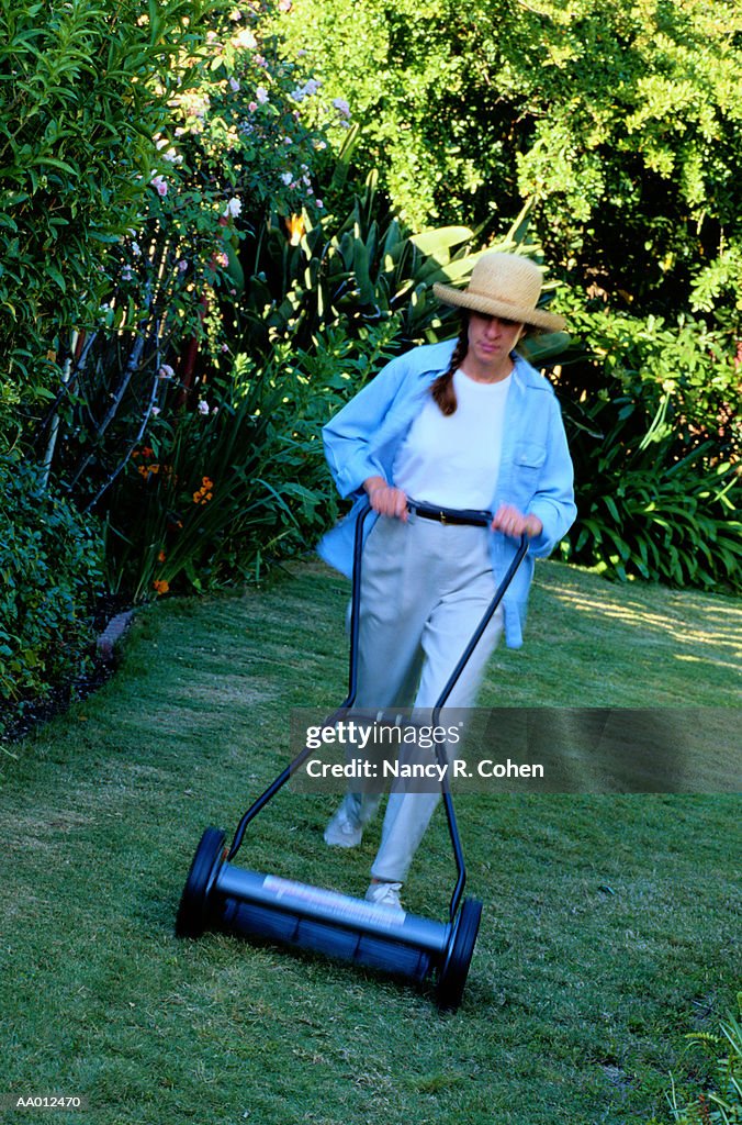 Woman Mowing Lawn