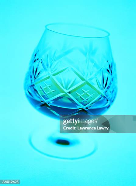 crystal snifter filled with a drink - bicchiere da brandy foto e immagini stock