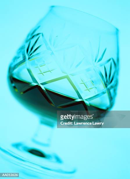 crystal snifter filled with a drink - brandy snifter stock pictures, royalty-free photos & images
