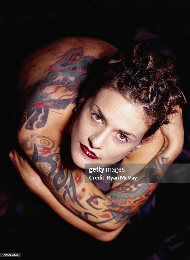 Young woman with tattoos, portrait, overhead view
