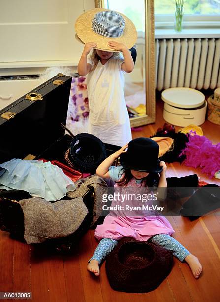 girls playing dress-up - caixa de chapéu imagens e fotografias de stock