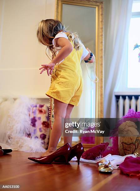 rear view of a girl wearing high heels - girls high heels stock-fotos und bilder