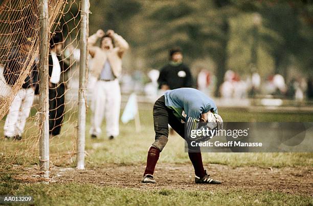 goalie bending over after missing a goal - amature stock pictures, royalty-free photos & images