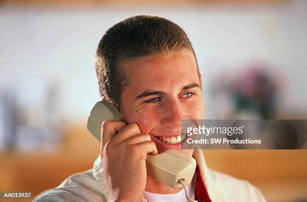 portrait of a boy talking on the telephone - crew cut stock pictures, royalty-free photos & images