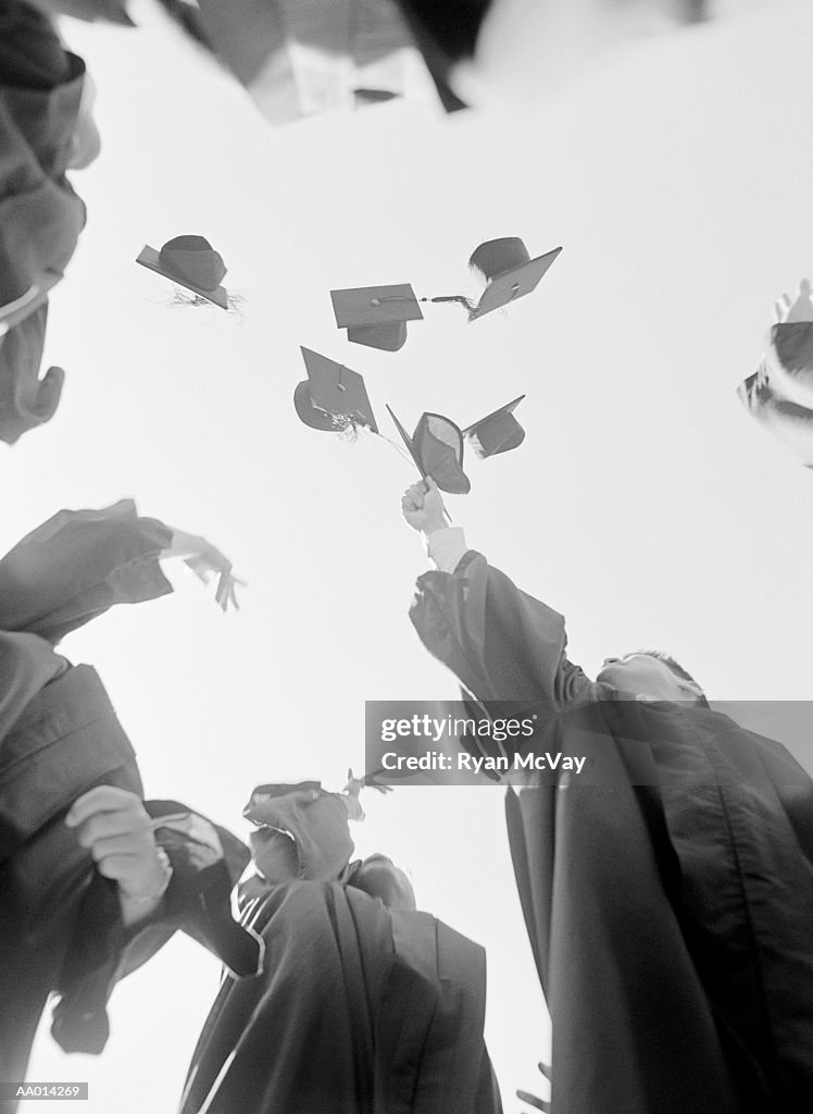 Graduates Throwing Mortarboards in the Air