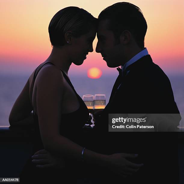 silhouette of a couple on a cruise ship - man tuxedo profile stock pictures, royalty-free photos & images