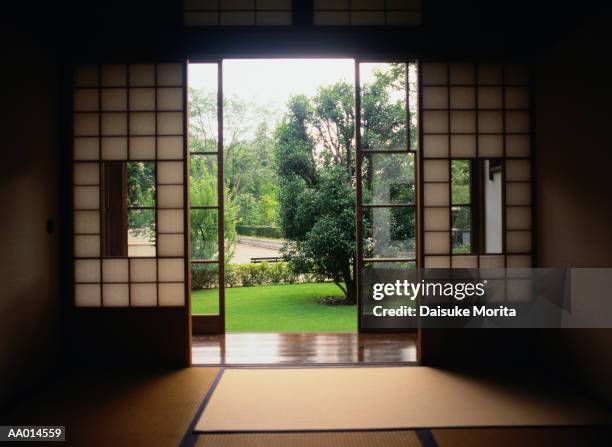 view of a garden from inside a room - 和室　無人 ストックフォトと画像