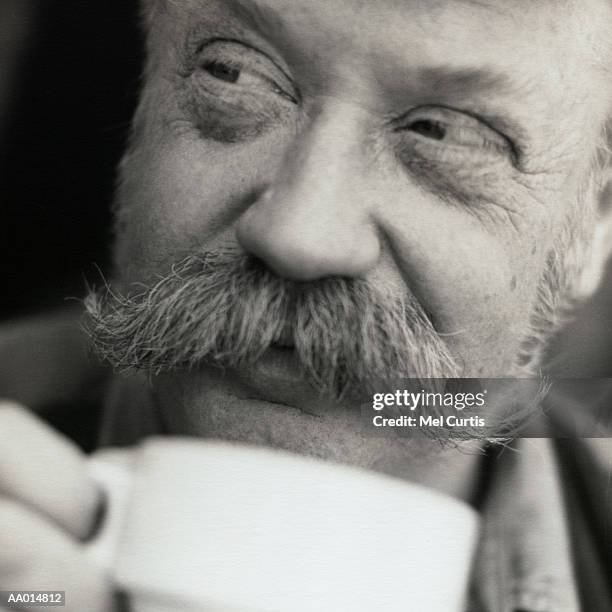 portrait of a man drinking coffee - handlebar moustache stock pictures, royalty-free photos & images