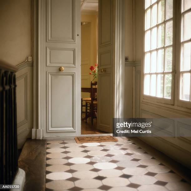 apartment with door ajar - apartment corridor stock pictures, royalty-free photos & images