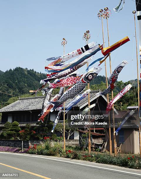 windsocks along a road - windsock stock pictures, royalty-free photos & images