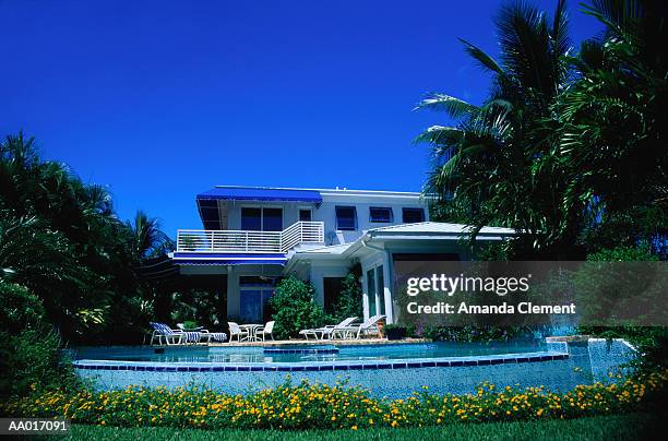 house and swimming pool in florida - supreme fiction stock pictures, royalty-free photos & images