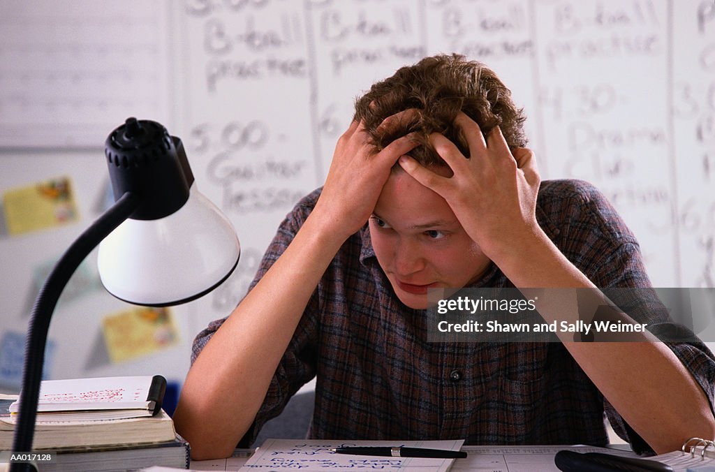 Teenage Boy with Hands in Hair