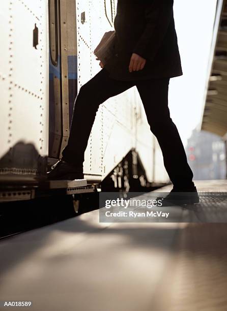 boarding a train - stepping stock pictures, royalty-free photos & images