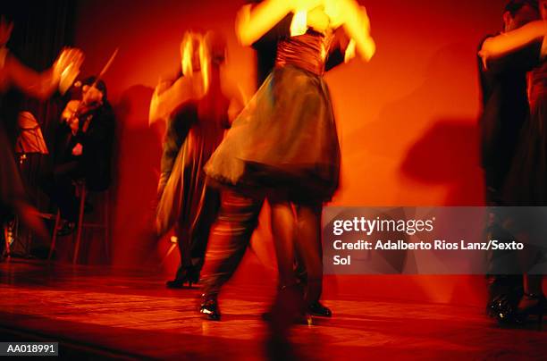 couples dancing the tango on dance floor - south america dance stockfoto's en -beelden