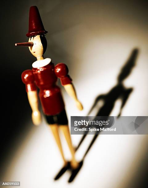 wooden figurine - long nose stock pictures, royalty-free photos & images