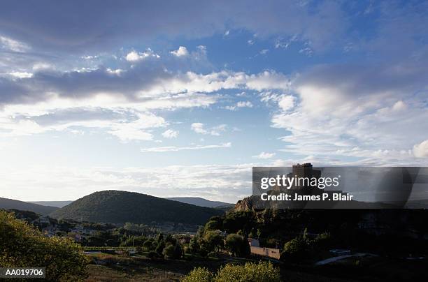 ruins of a castle on a hill in vaison la romaine - romaine stockfoto's en -beelden