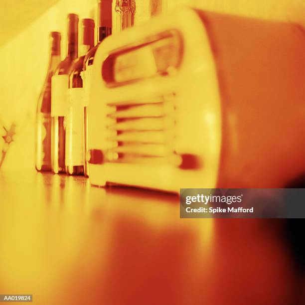 close-up of a radio and bottles of wine - portable radio stock pictures, royalty-free photos & images