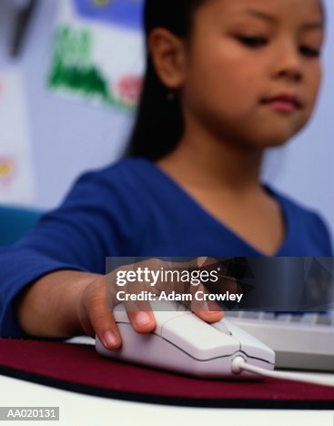Girl Using a Computer Mouse Girl Using a Computer Mouse