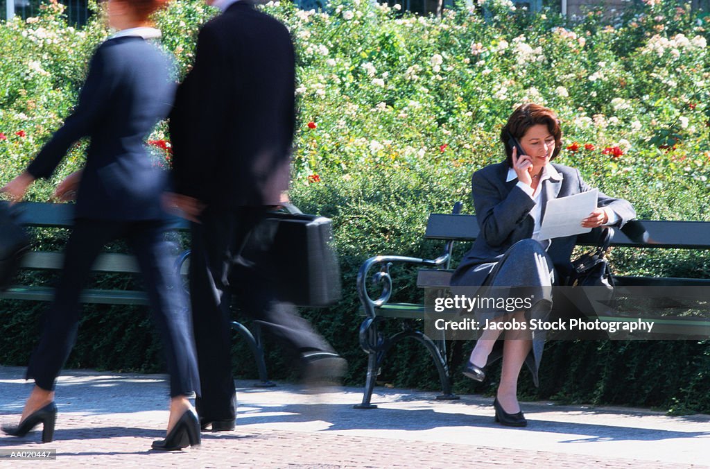 Businesswoman Sitting on a Park Bench