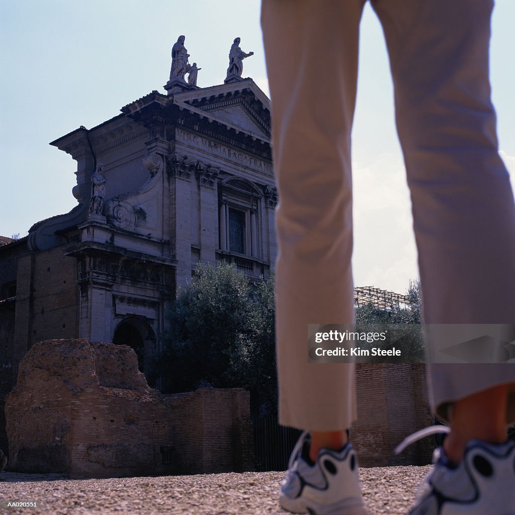 Italy, Rome, Forum, tourist at Arch of Titus, rear view, low section