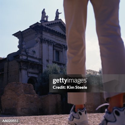 Italy, Rome, Forum, tourist at Arch of Titus, rear view, low section Italy, Rome, Forum, tourist at Arch of Titus, rear view, low section