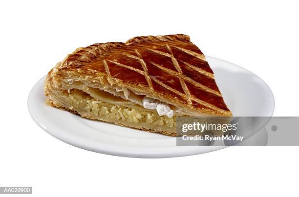 slice of an epiphany cake on a plate - galette photos et images de collection