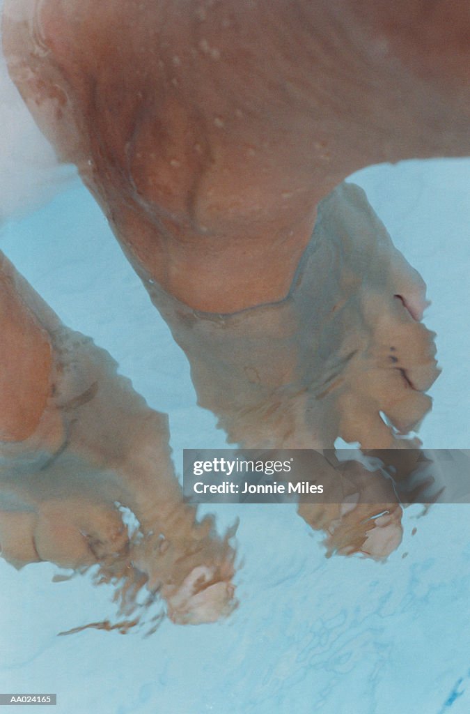 Woman's Feet Dangling in Water