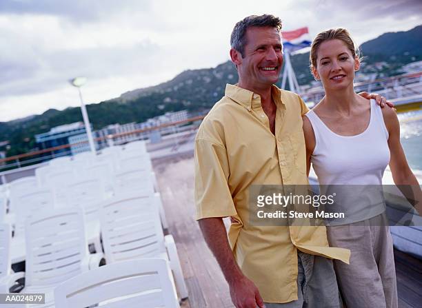 couple on a cruise ship - mid adult couple stockfoto's en -beelden