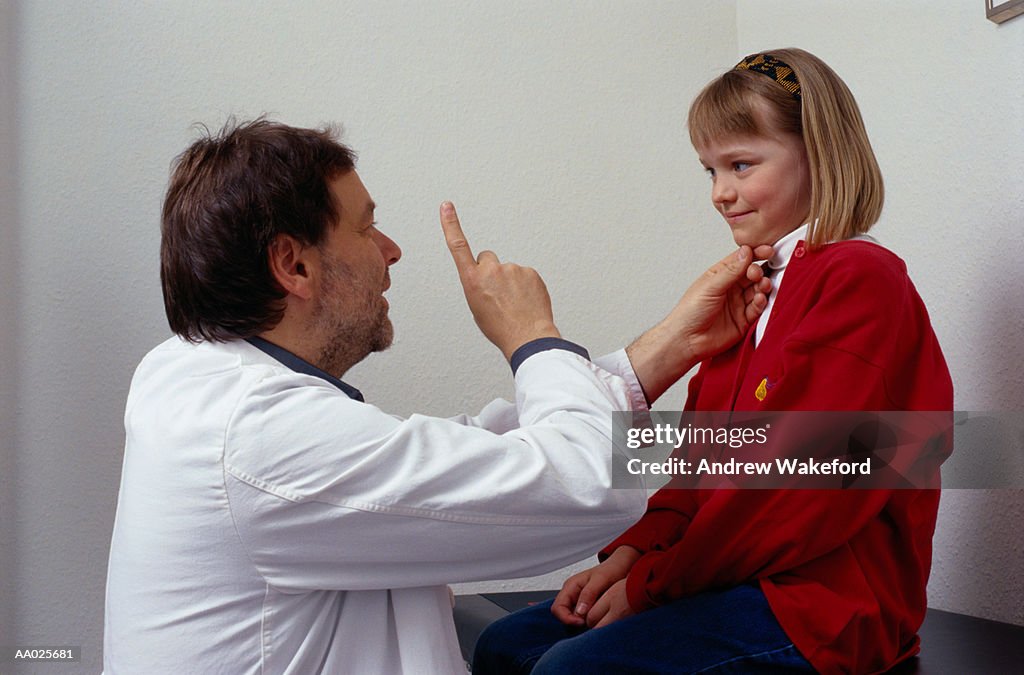 Doctor Examining a Girl