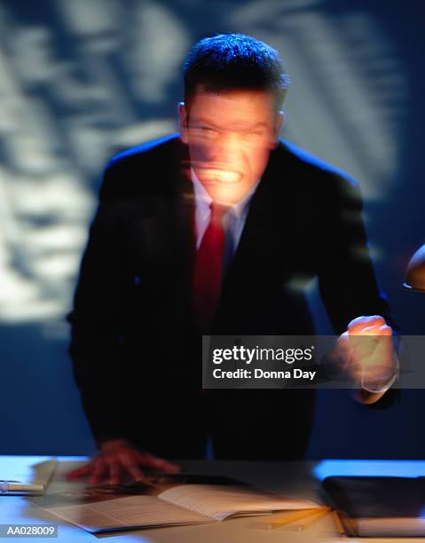 angry businessman clenching teeth and grimacing - donna elegante stock-fotos und bilder