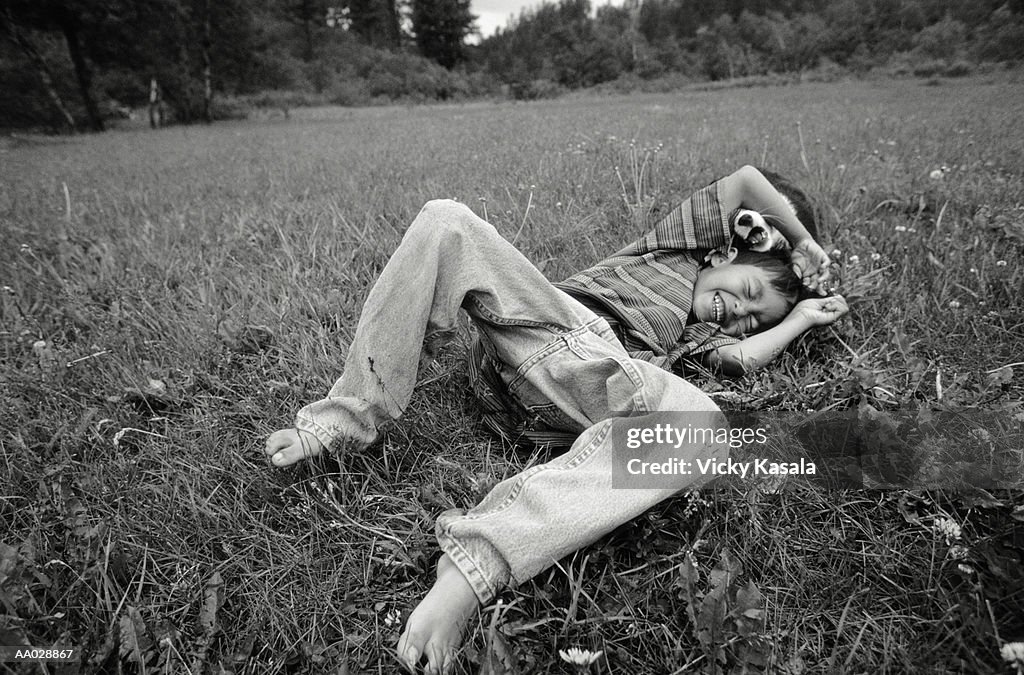 Boy Playing with a Puppy, Montana