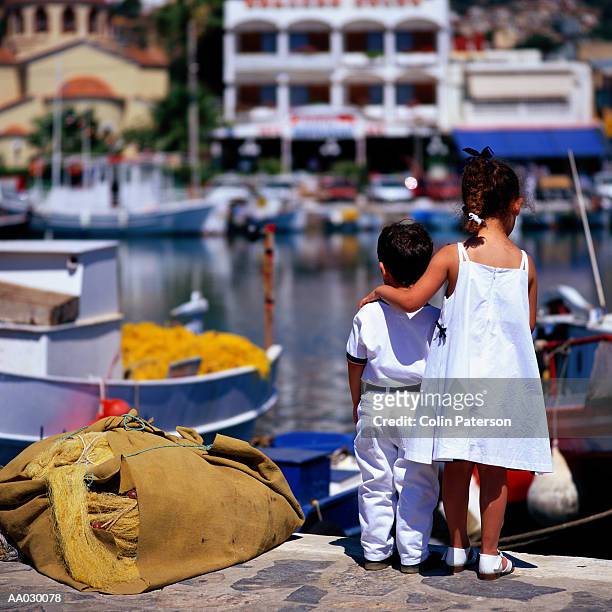 children at the harbor - sea of crete stock pictures, royalty-free photos & images