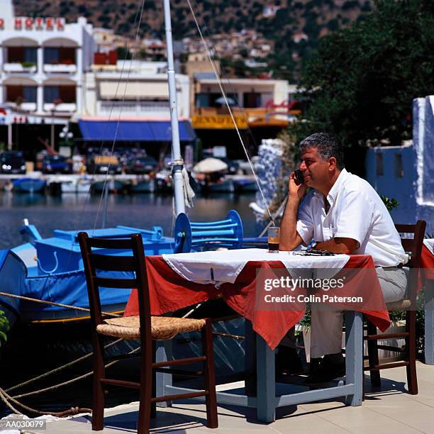 man at a caf? - greek ethnicity stock pictures, royalty-free photos & images