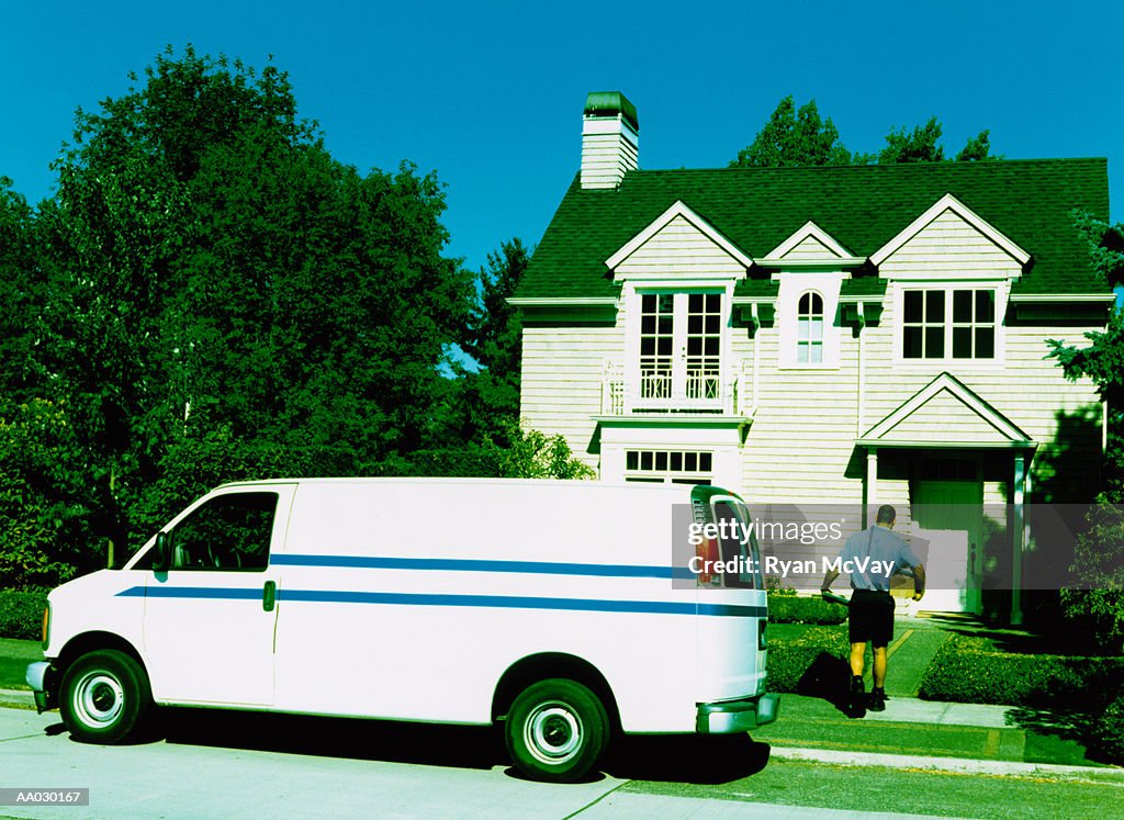 Man Delivering Package to Home