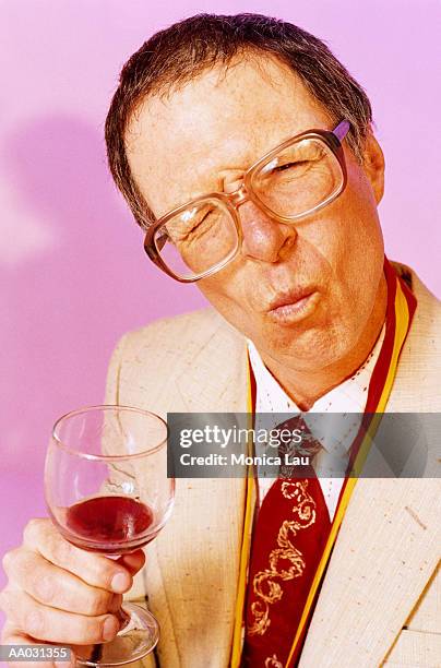 nerdy winetaster guy tasting bad wine - bad condition ストックフォトと画像