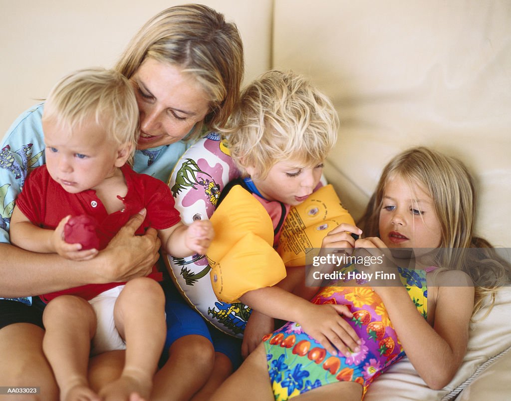 Mother Entertaining Her Three Young Children