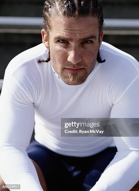 young man sitting on stadium bleachers - soul patch stock pictures, royalty-free photos & images