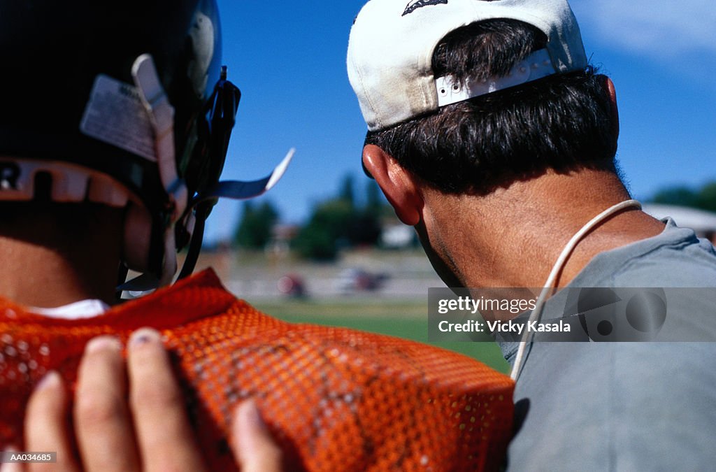 American Football Coach With a Player