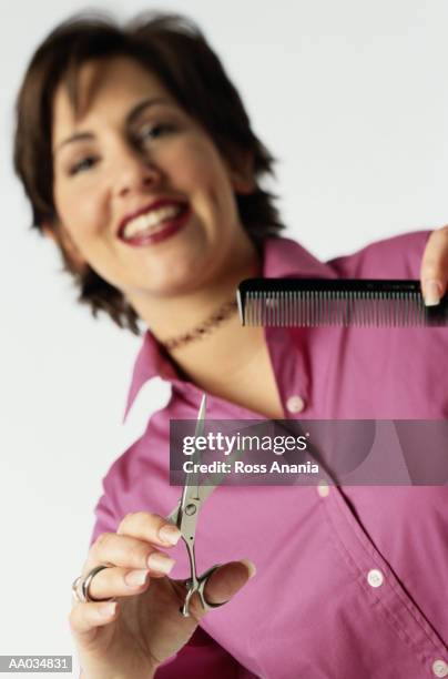 portrait of a hairdresser - kappersschaar stockfoto's en -beelden