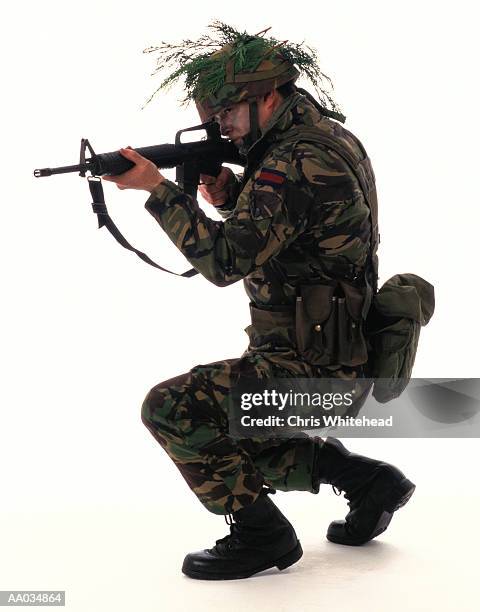 soldier aiming a gun - gibbs stock pictures, royalty-free photos & images