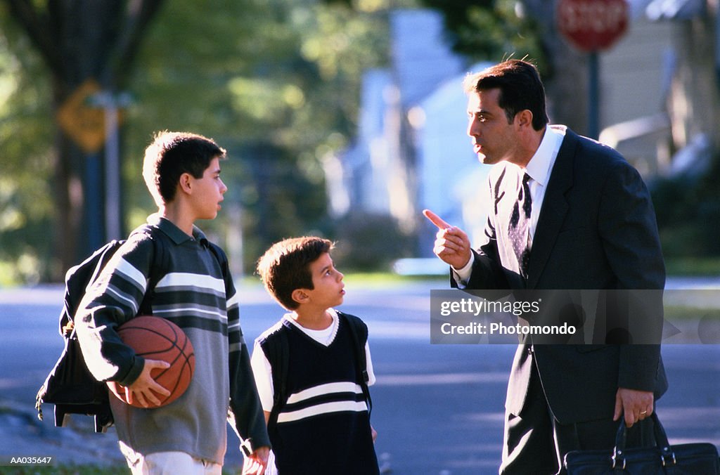 Father Scolding His Two Sons