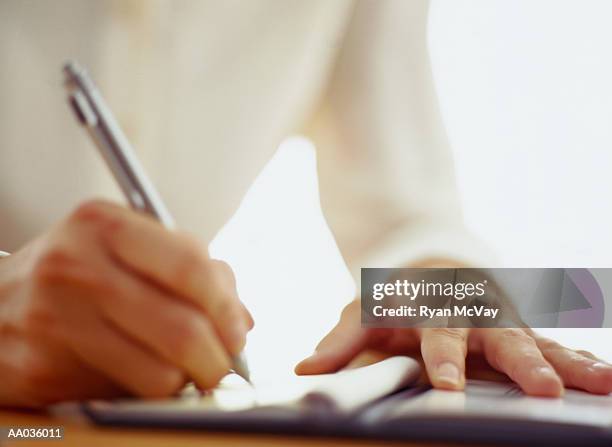 Woman Writecheck 269 Woman Writing A Check Stock Photos, High-Res Pictures, and Images ...